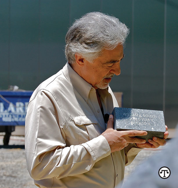 Actor Joe Mantegna holds a commemorative brick    honoring his uncle, William J. Novelli. It will be part of the National    Museum of the United States Army.